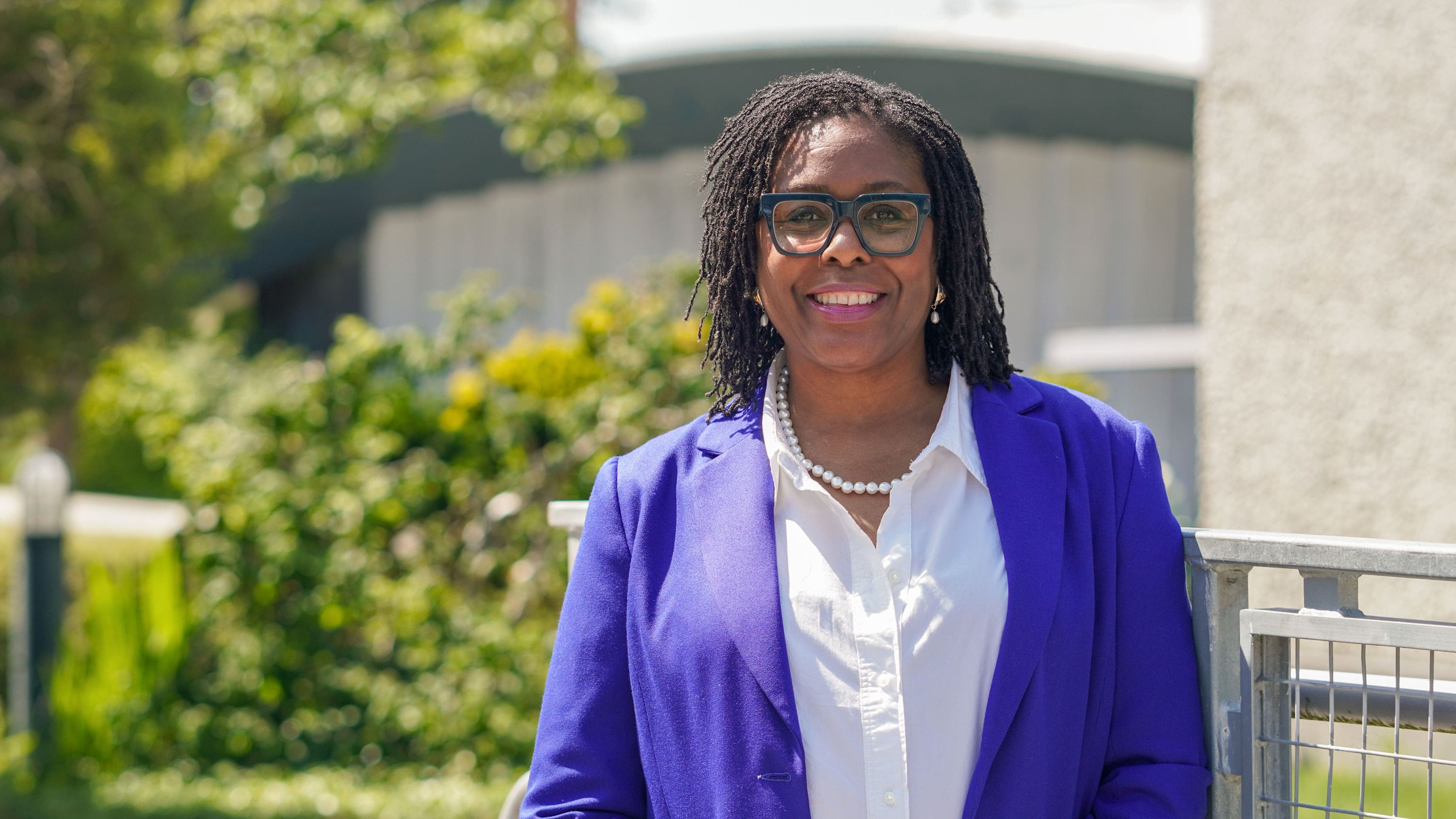 Dr. Jamilyn Penn wearing a blue blazer and white collared shirt